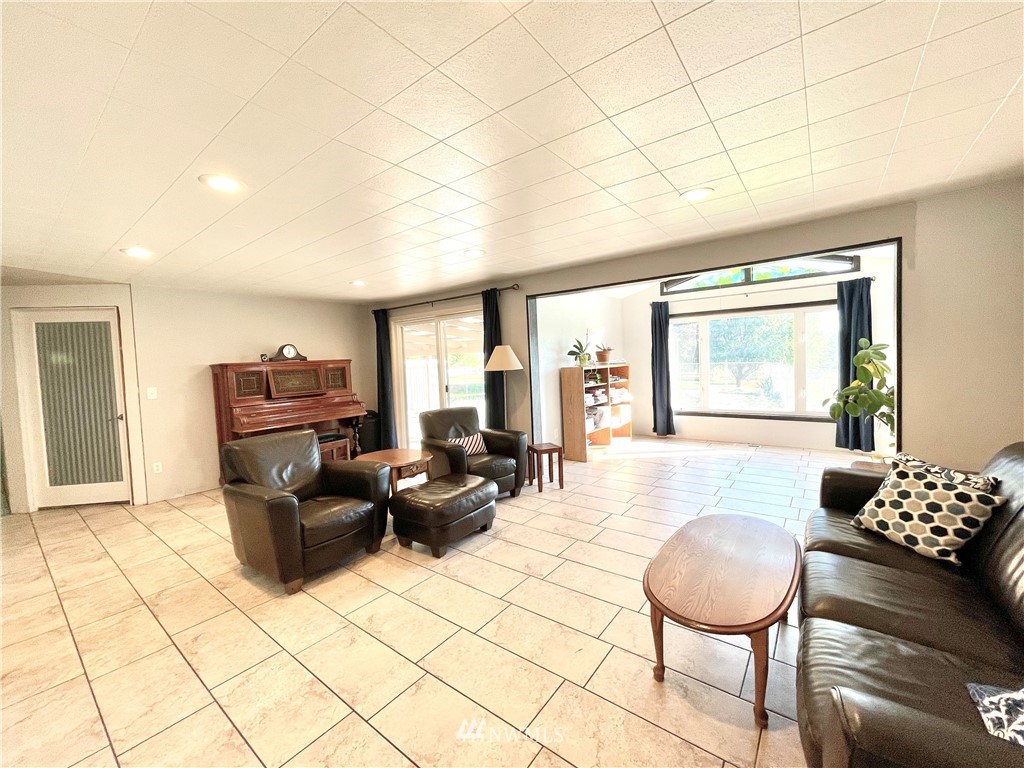 28 Dixon Road Omak, WA 98841 - Photo 10 of 39 a living room with furniture and a large window
