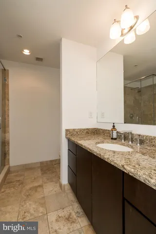 a bathroom with a bathtub and shower