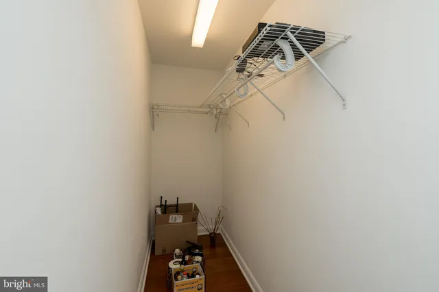 a view of a room with a wooden floor