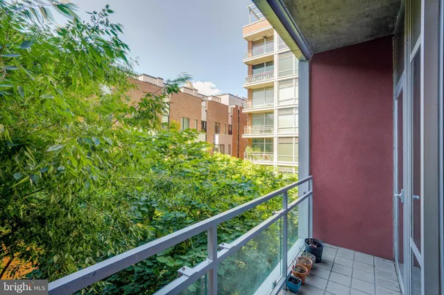 a view of balcony with two chairs and a table