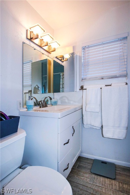 822 Beach Road Sanibel, FL 33957 - Photo 15 of 35 a bathroom with a sink a toilet and mirror