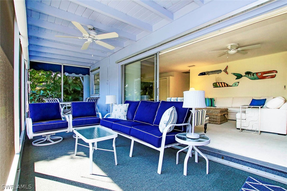 822 Beach Road Sanibel, FL 33957 - Photo 20 of 35 a living room with furniture and a large window