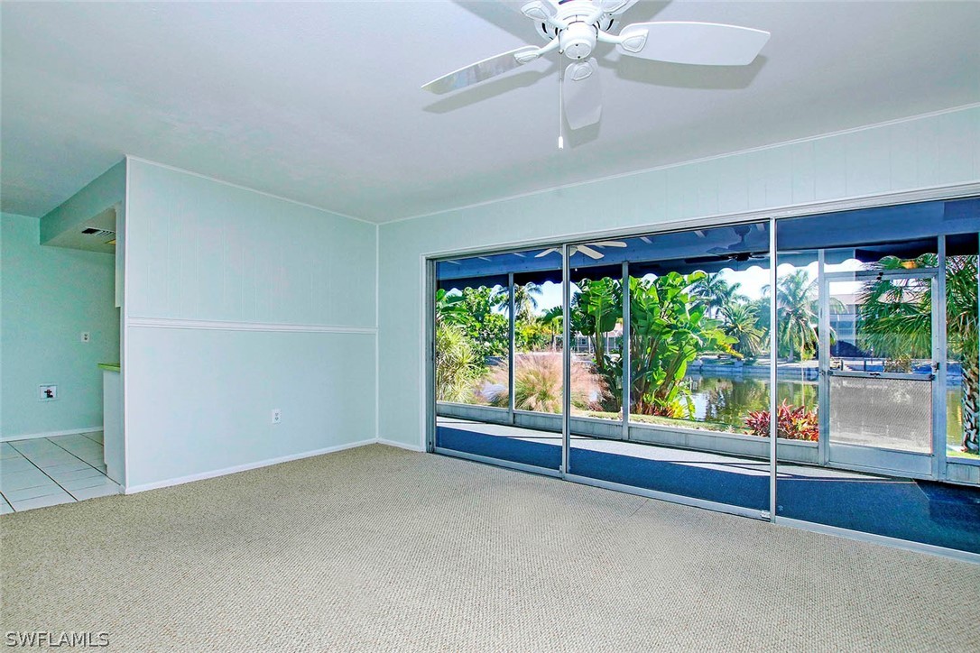 822 Beach Road Sanibel, FL 33957 - Photo 23 of 35 wooden floor in an empty room with a window