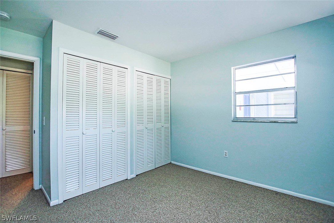 822 Beach Road Sanibel, FL 33957 - Photo 30 of 35 an empty room with windows