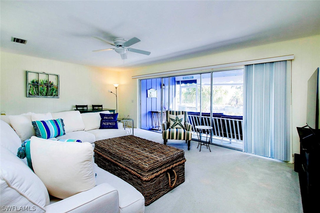 822 Beach Road Sanibel, FL 33957 - Photo 6 of 35 a living room with furniture and a window