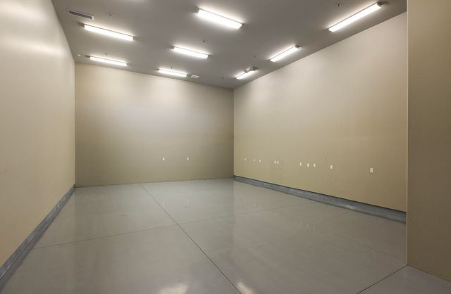 a view of hallway with wooden floor