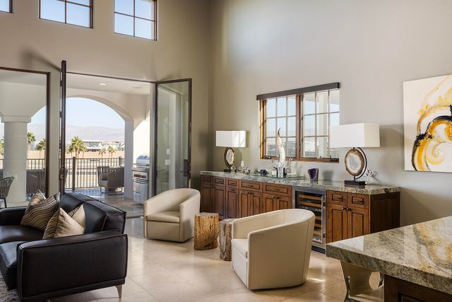 a kitchen with stainless steel appliances a sink and a refrigerator