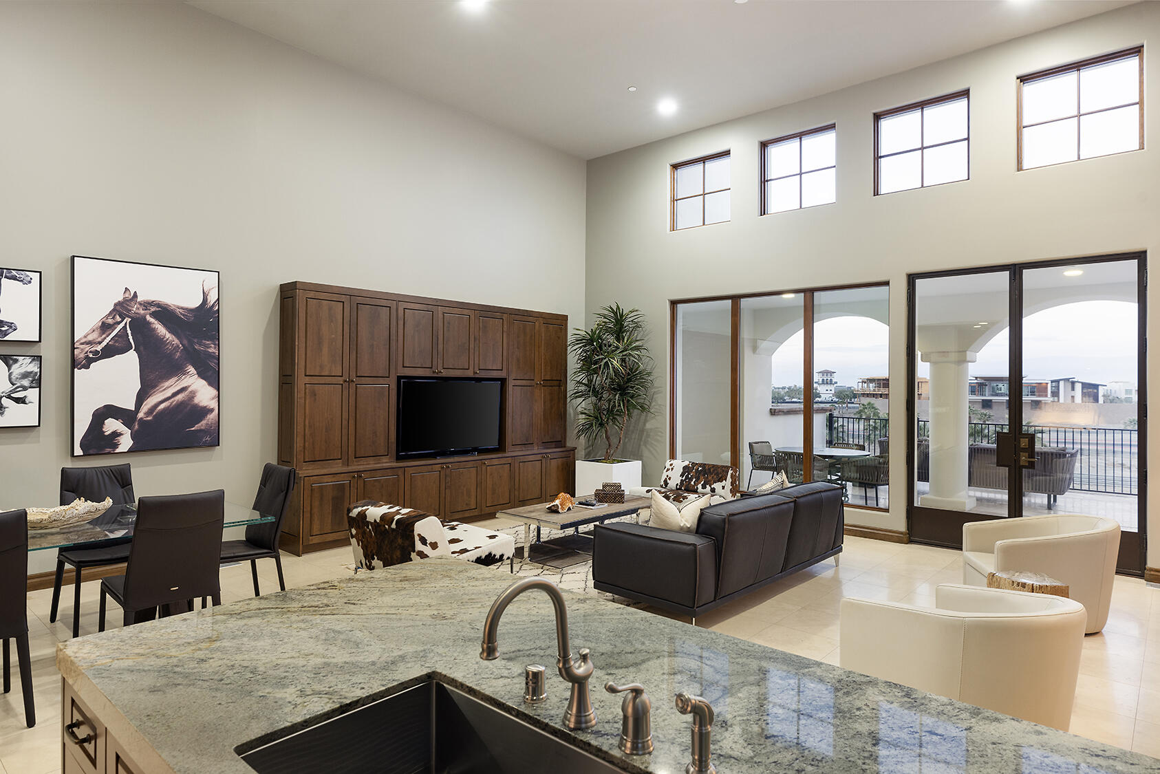 86816 Rogers Way Thermal, CA 92274 - Photo 18 of 29 a living room with furniture a large window and a flat screen tv