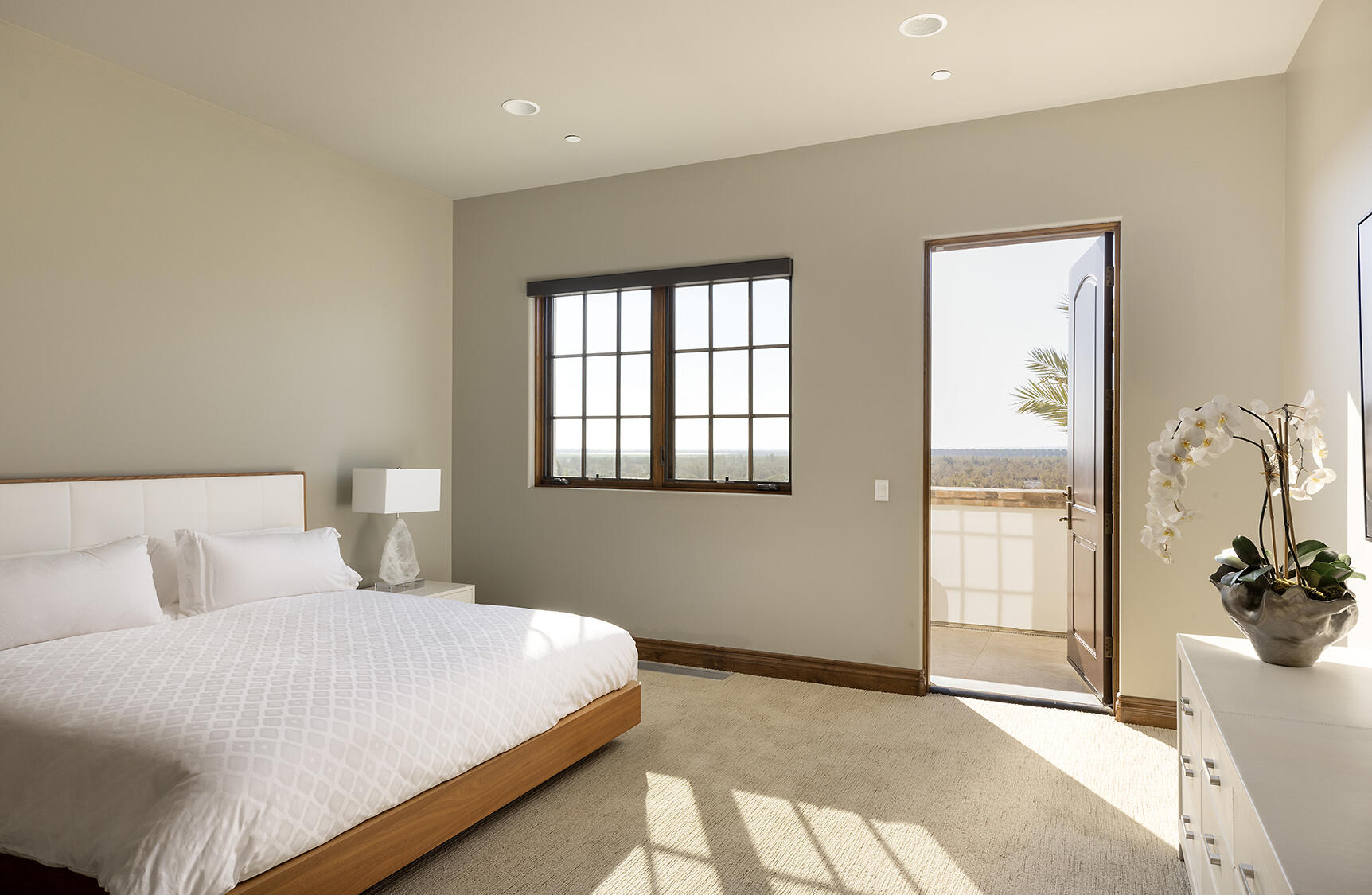 86816 Rogers Way Thermal, CA 92274 - Photo 19 of 29 a bedroom with a large bed and a potted plant