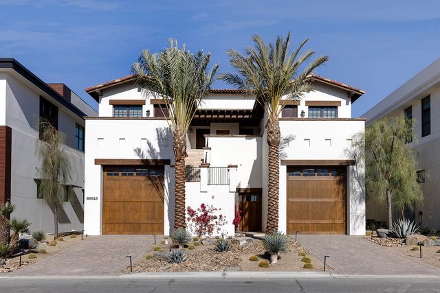 a view of swimming pool with outdoor seating and city view