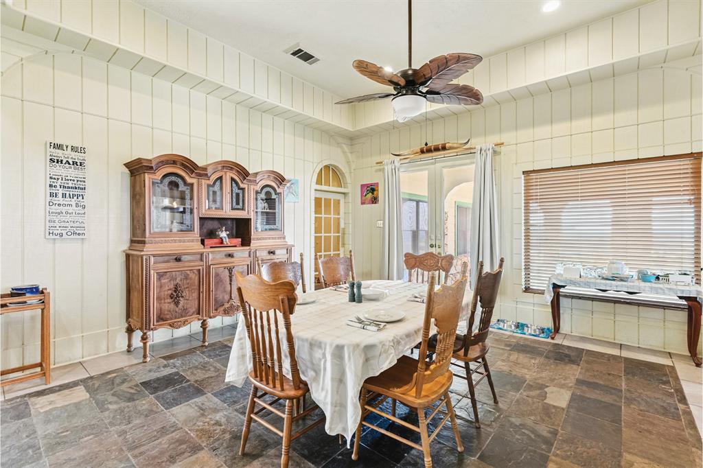 10771 6th Highway Meridian, TX 76665 - Photo 19 of 40 Dining room featuring a ceiling fan and french doors
