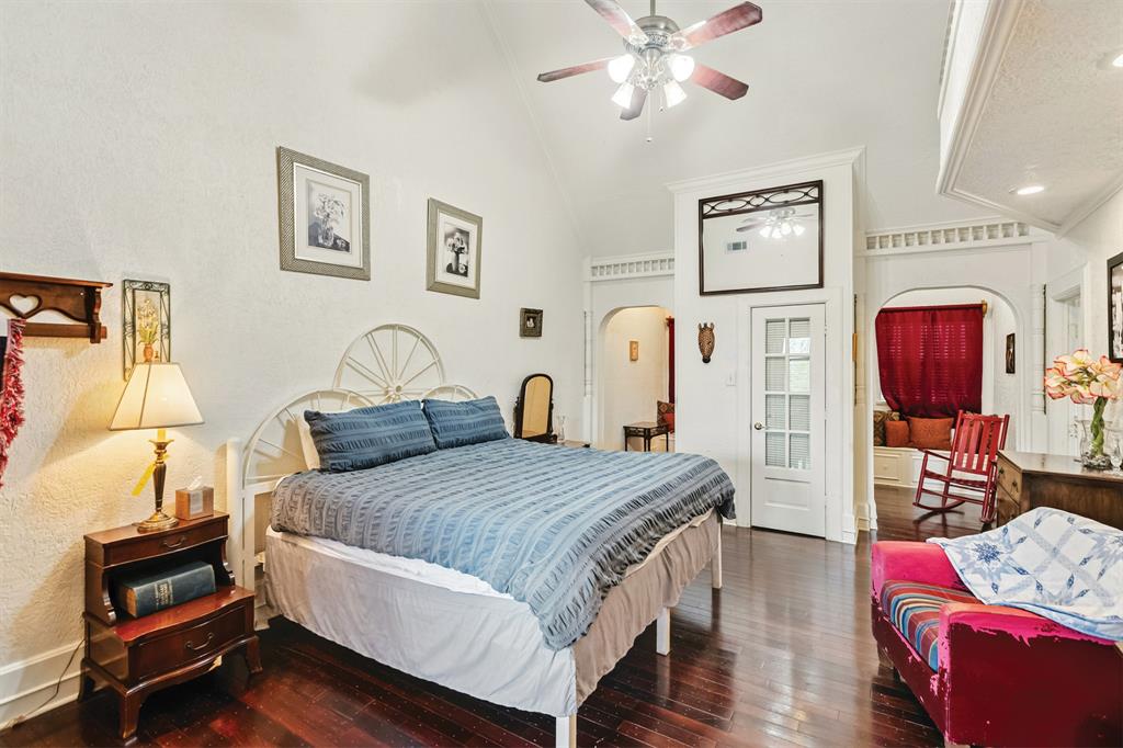 10771 6th Highway Meridian, TX 76665 - Photo 27 of 40 Bedroom featuring dark wood-style flooring, a ceiling fan, high vaulted ceiling, recessed lighting, and arched walkways