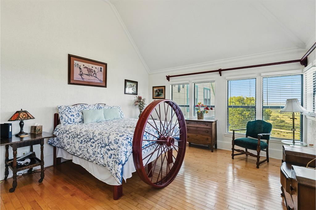 10771 6th Highway Meridian, TX 76665 - Photo 31 of 40 Bedroom with light wood-style floors and high vaulted ceiling