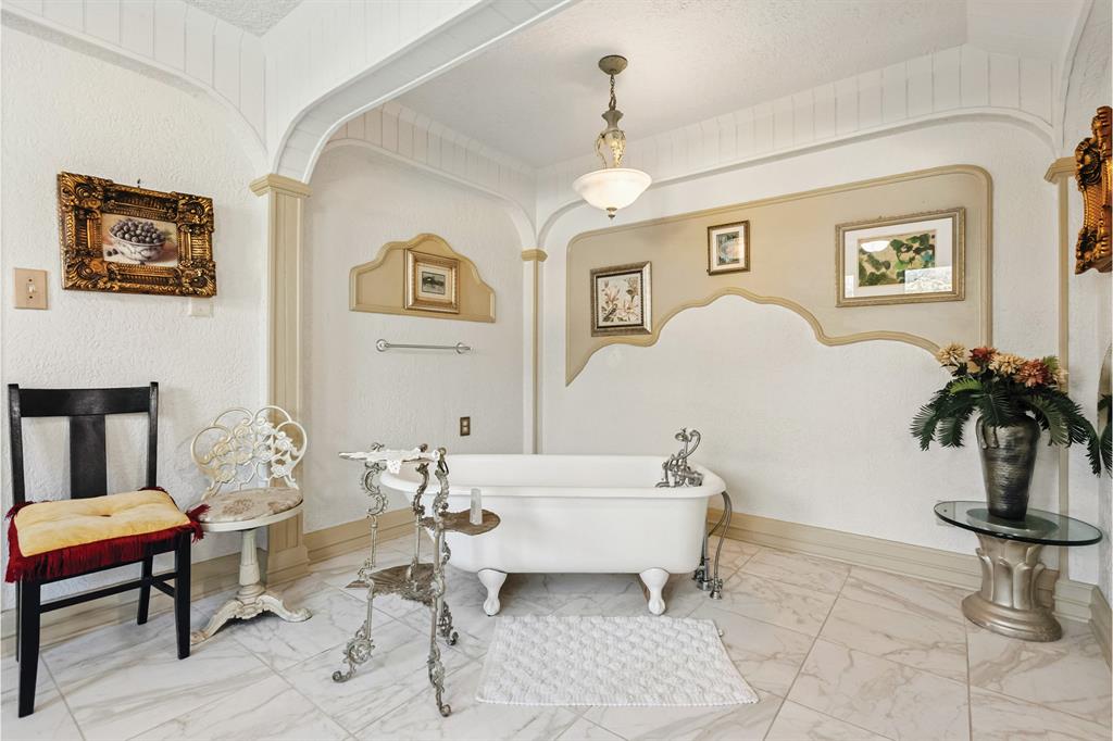 10771 6th Highway Meridian, TX 76665 - Photo 36 of 40 Full bathroom with a soaking tub and marble finish flooring