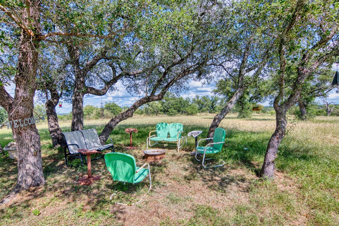 12119 Highway 29 Llano, TX 78643 - Photo 14 of 40 a view of a chairs and table in the yard