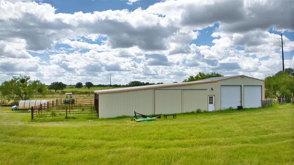 a view of a backyard with garden