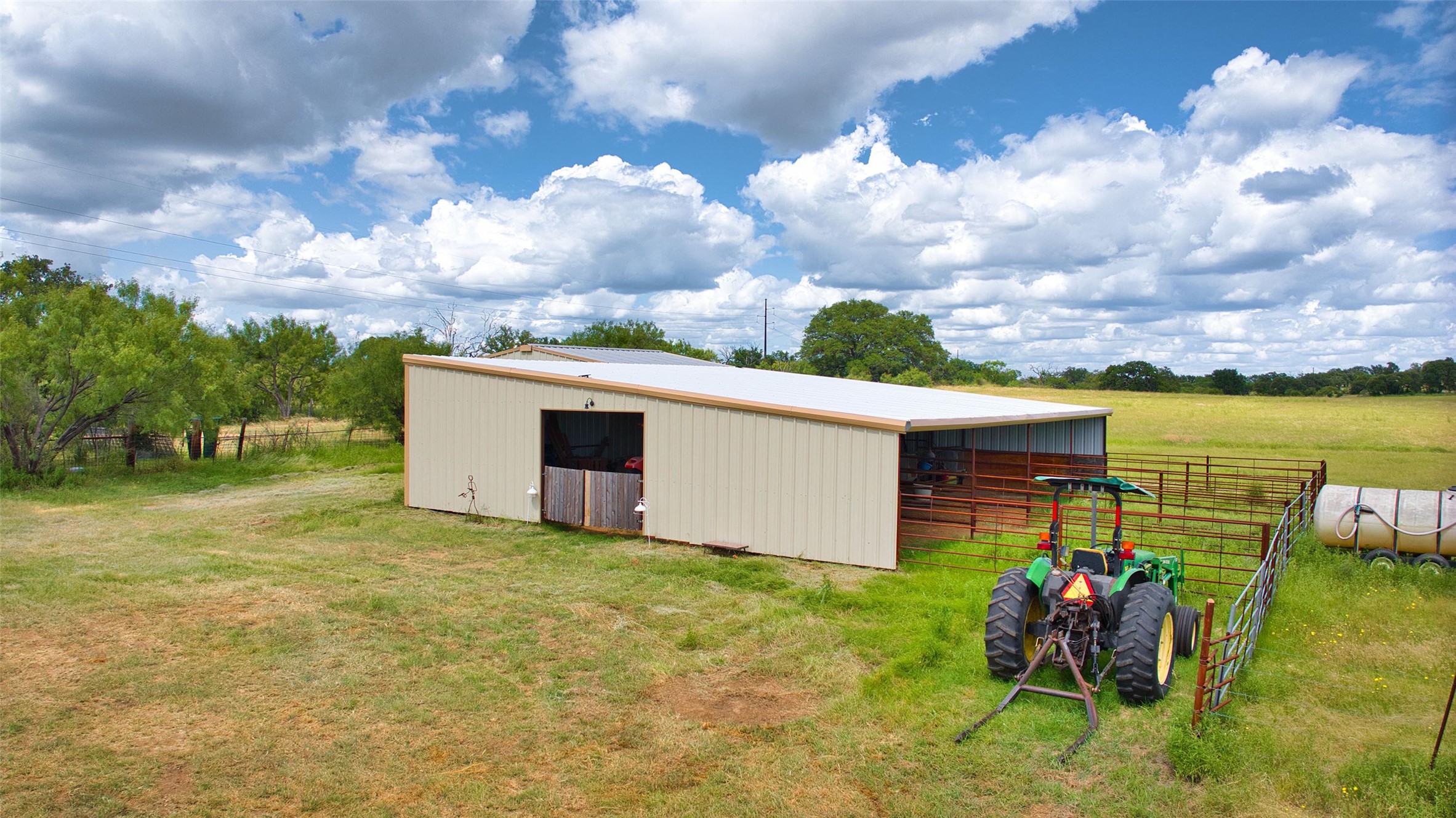 12119 Highway 29 Llano, TX 78643 - Photo 19 of 40 View of pole building featuring an exterior structure and a view of rural / pastoral area