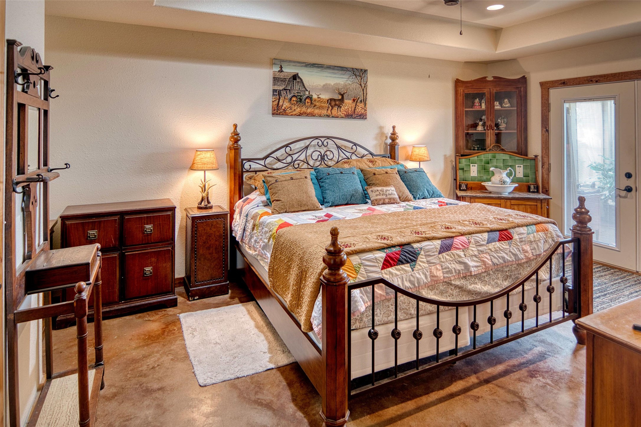 12119 Highway 29 Llano, TX 78643 - Photo 8 of 40 Carpeted bedroom with a tray ceiling and recessed lighting