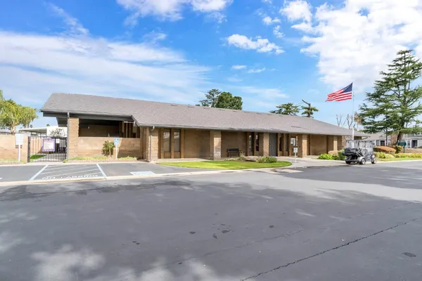 a view of a kitchen with a sink and cabinets
