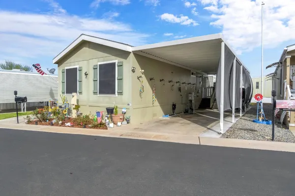 a view of a house with basketball court