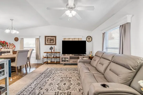 a living room with furniture and a flat screen tv