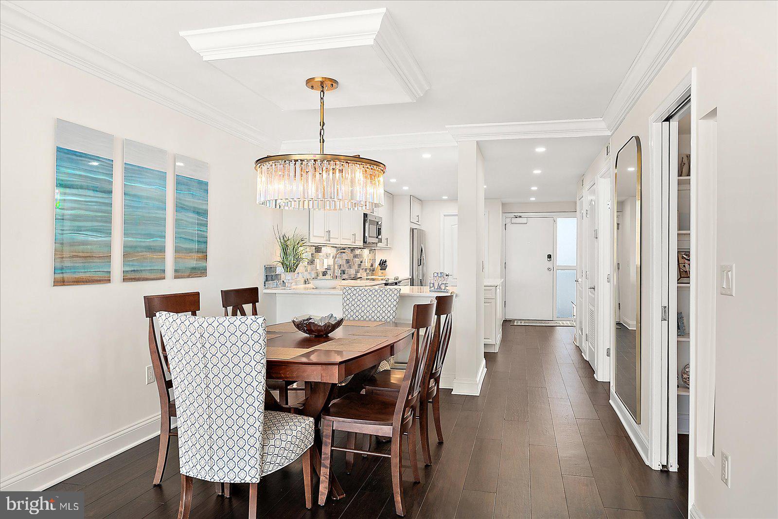 903 North Edgewater House Road Bethany Beach, DE 19930 - Photo 16 of 43 a view of a dining room with furniture window and wooden floor