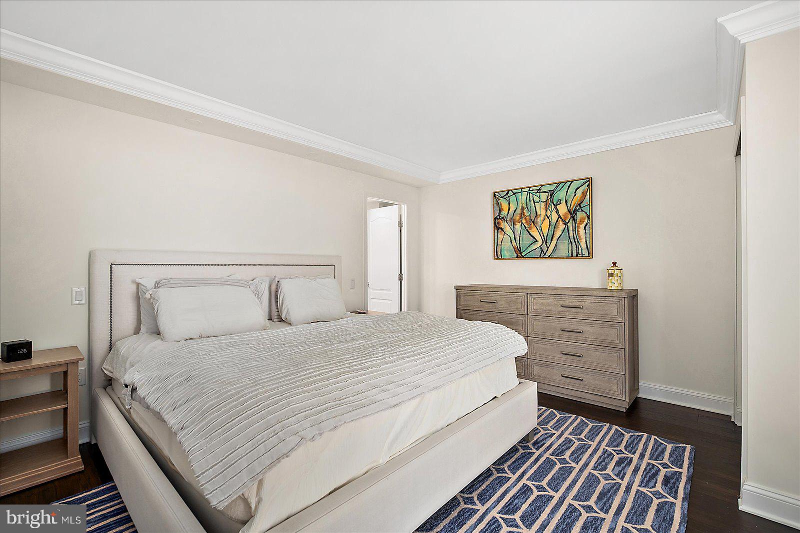 903 North Edgewater House Road Bethany Beach, DE 19930 - Photo 19 of 43 a bedroom with a bed and painting on the wall