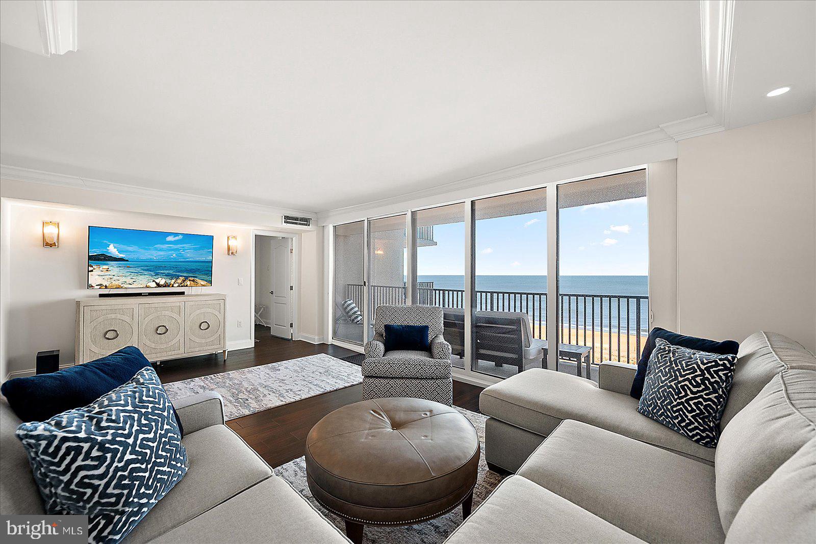 903 North Edgewater House Road Bethany Beach, DE 19930 - Photo 2 of 43 a living room with furniture and a flat screen tv