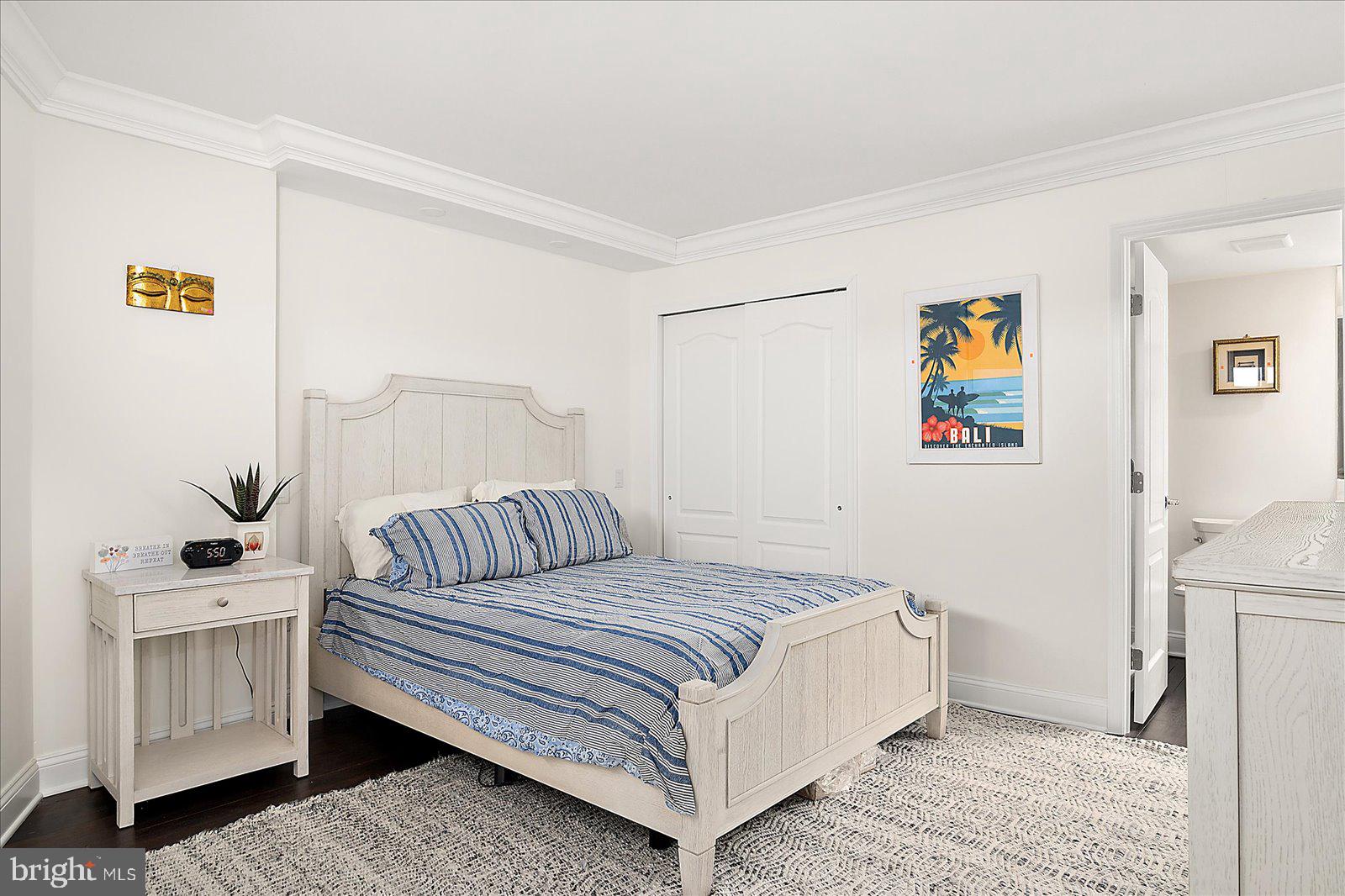 903 North Edgewater House Road Bethany Beach, DE 19930 - Photo 22 of 43 a bedroom with a bed and painting on the wall