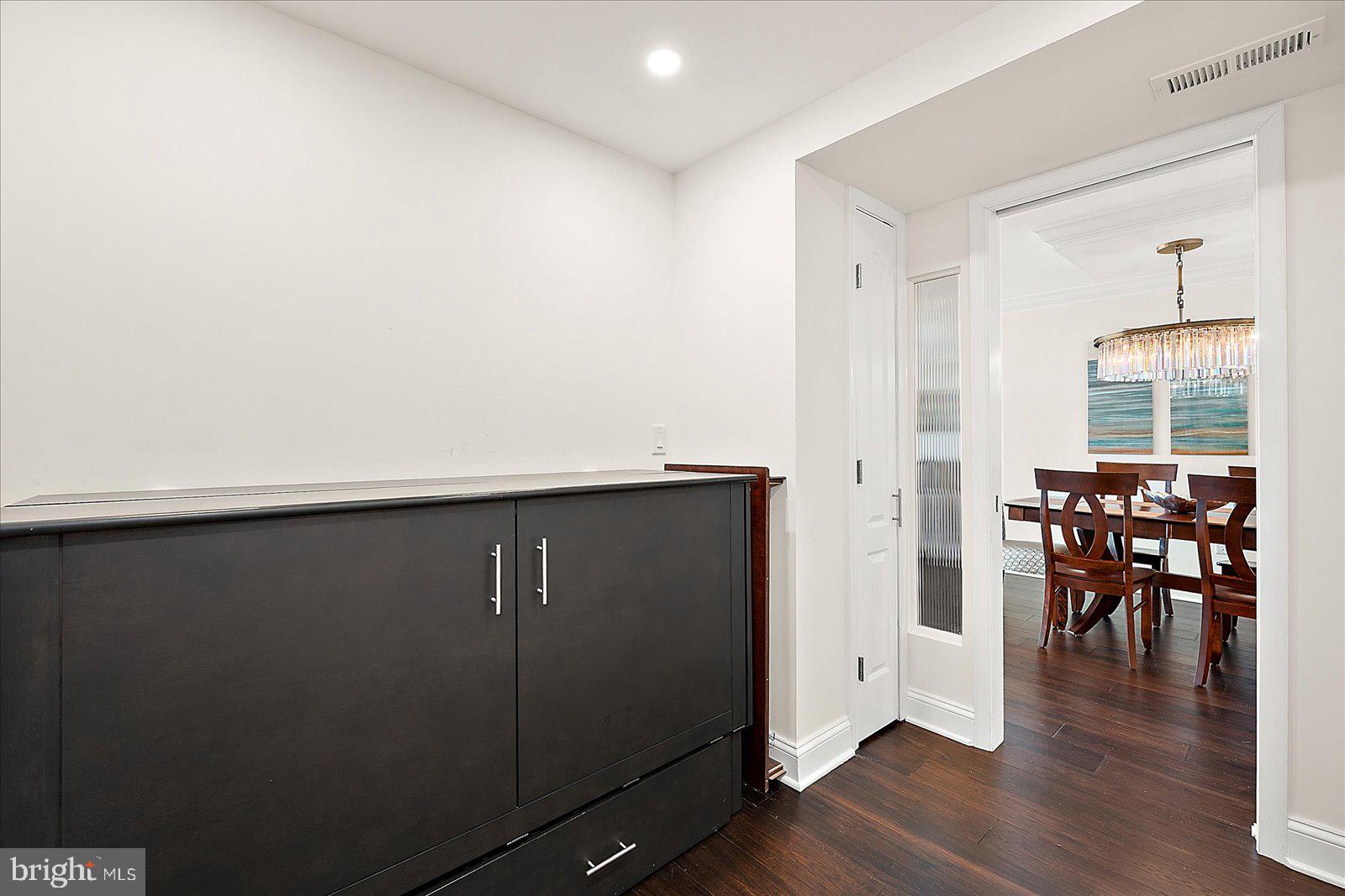 903 North Edgewater House Road Bethany Beach, DE 19930 - Photo 27 of 43 an empty room with wooden floor and windows