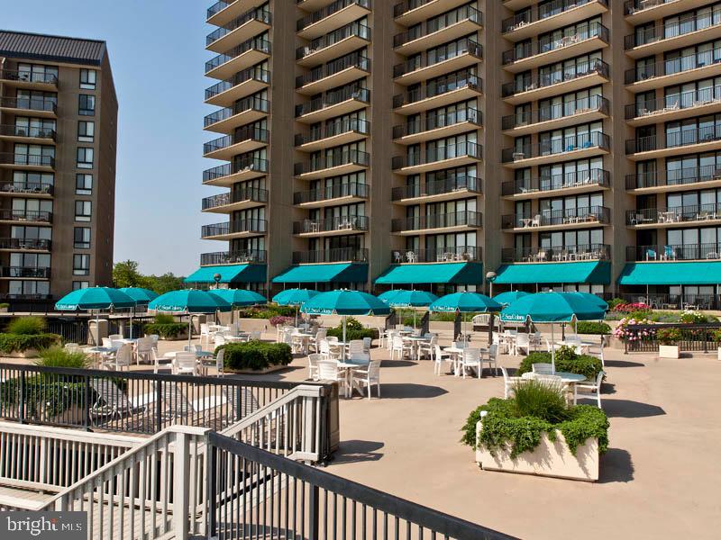 903 North Edgewater House Road Bethany Beach, DE 19930 - Photo 38 of 43 a view of a patio with a table and chairs