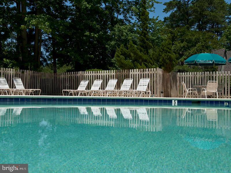 903 North Edgewater House Road Bethany Beach, DE 19930 - Photo 40 of 43 a view of a deck with a yard