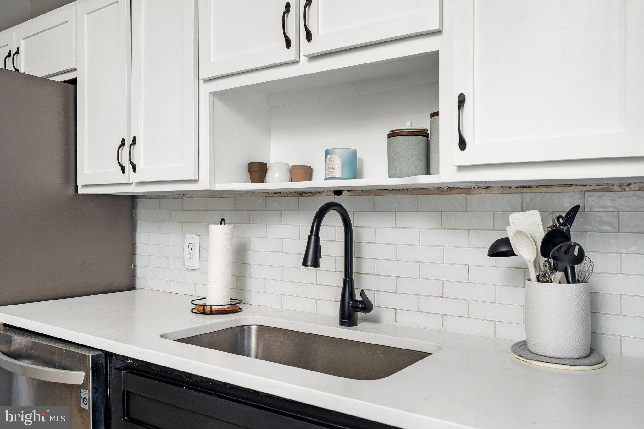831 Conte Avenue Brick, NJ 08724 - Photo 11 of 27 a kitchen with a sink and cabinets