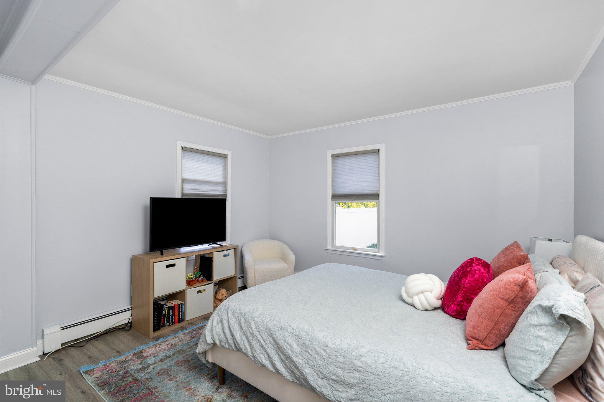 831 Conte Avenue Brick, NJ 08724 - Photo 14 of 27 a bedroom with a bed and a flat screen tv