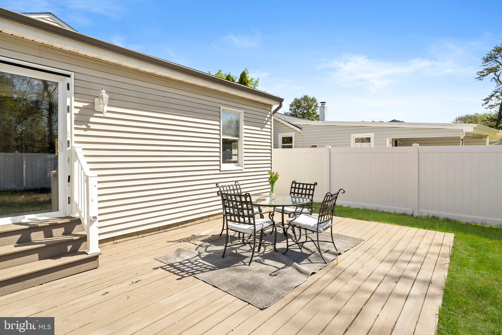 831 Conte Avenue Brick, NJ 08724 - Photo 24 of 27 a view of a patio with table and chairs and wooden floor