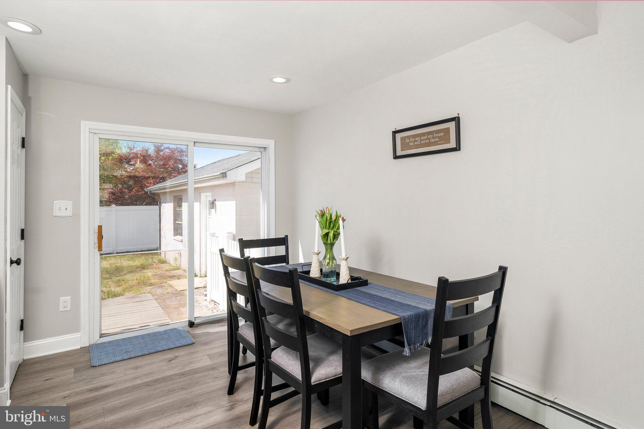 831 Conte Avenue Brick, NJ 08724 - Photo 10 of 27 a view of a dining room with furniture window and wooden floor