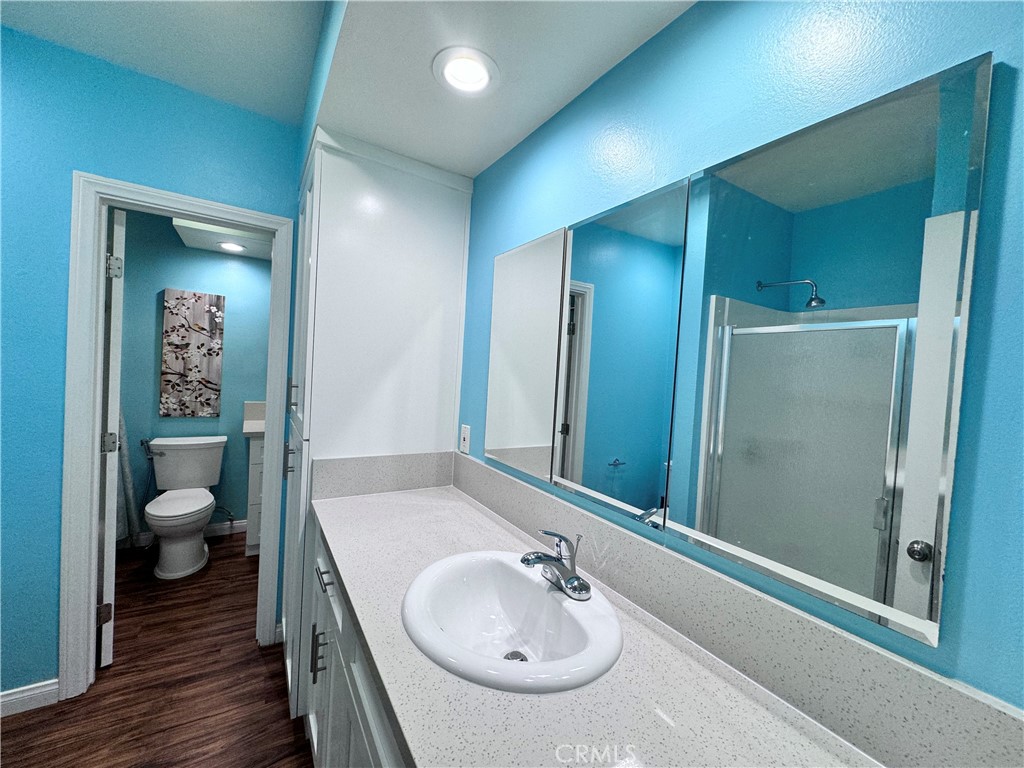 346 Miraleste Drive, Unit 301 San Pedro, CA 90732 - Photo 13 of 22 a bathroom with a sink and a mirror