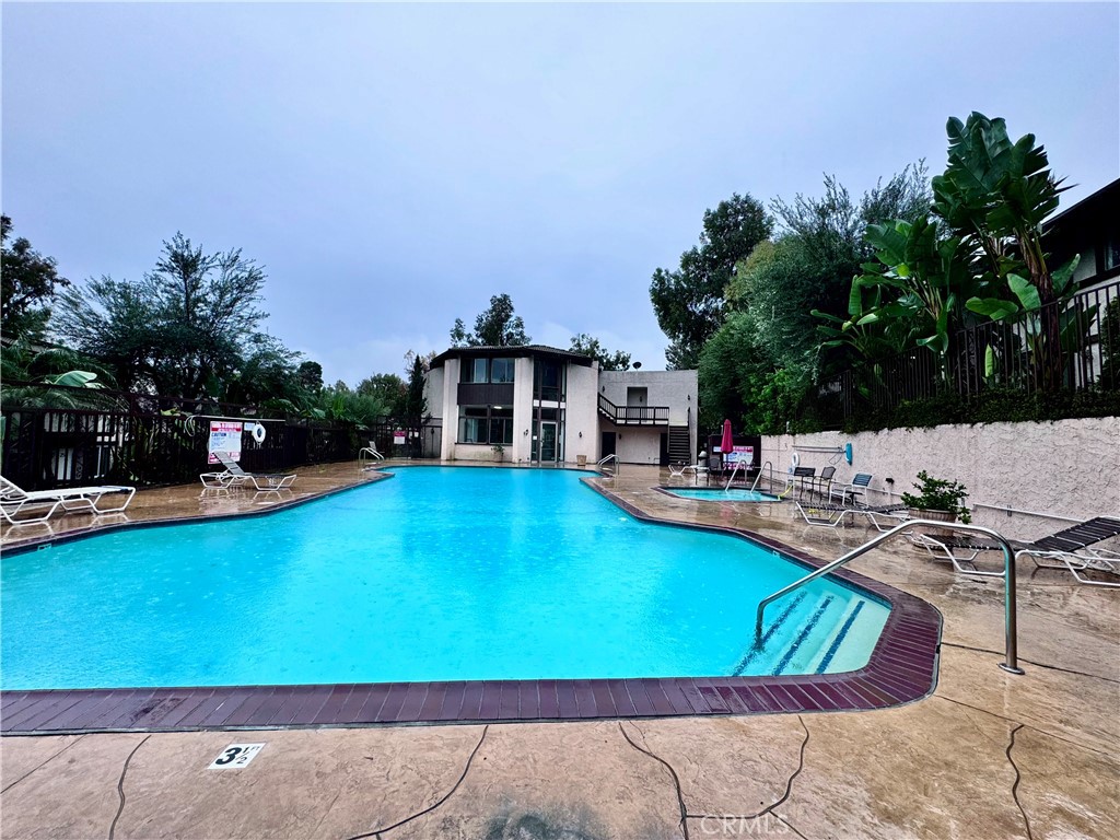 346 Miraleste Drive, Unit 301 San Pedro, CA 90732 - Photo 18 of 22 a view of a swimming pool with lounge chairs