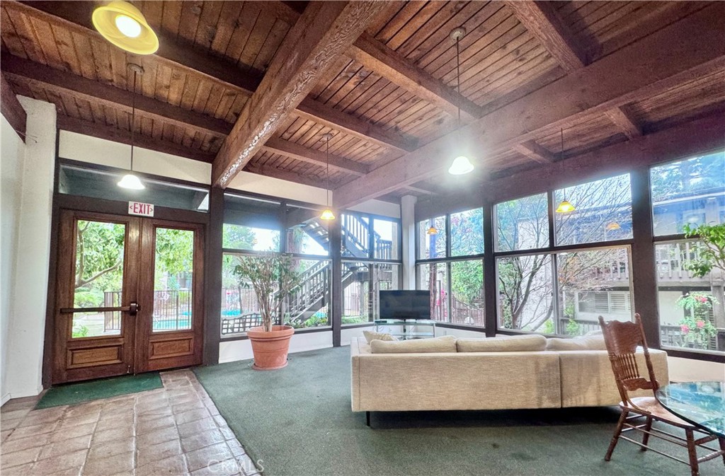 346 Miraleste Drive, Unit 301 San Pedro, CA 90732 - Photo 19 of 22 a living room with furniture and large windows