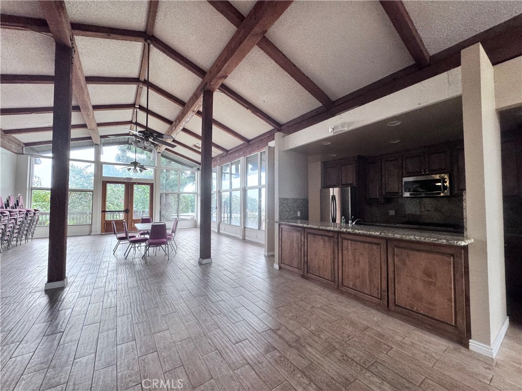 346 Miraleste Drive, Unit 301 San Pedro, CA 90732 - Photo 20 of 22 a kitchen with stainless steel appliances granite countertop a stove and cabinets with wooden floor
