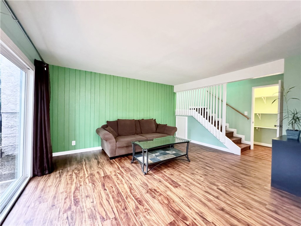 346 Miraleste Drive, Unit 301 San Pedro, CA 90732 - Photo 3 of 22 a living room with furniture and a wooden floor