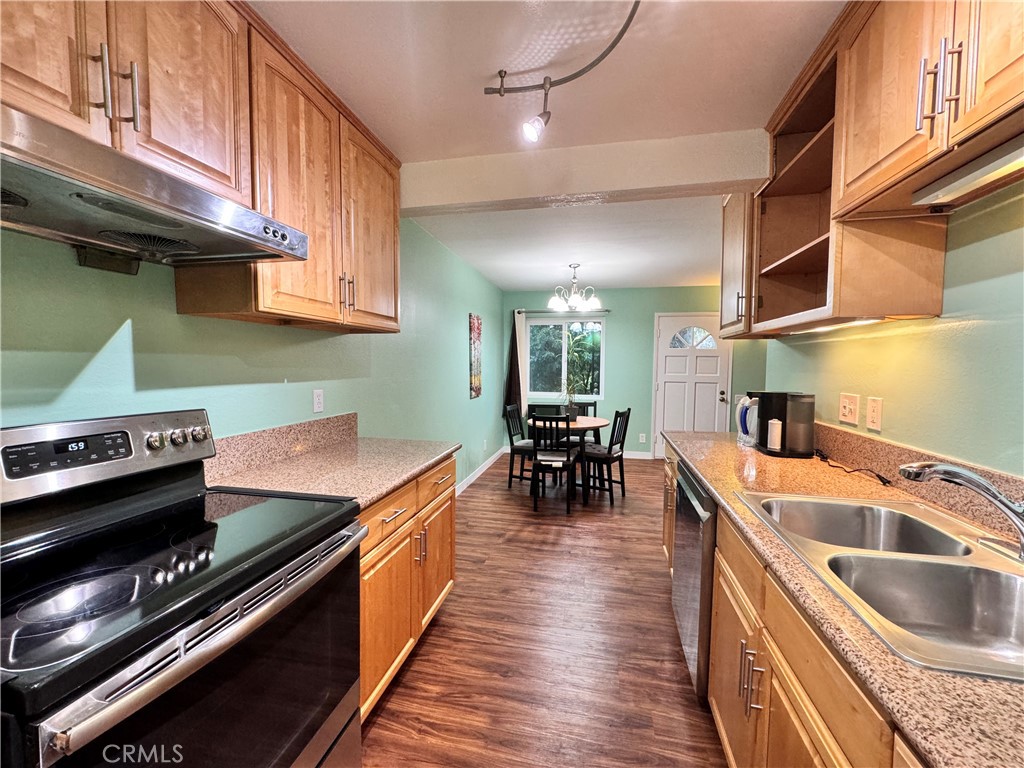346 Miraleste Drive, Unit 301 San Pedro, CA 90732 - Photo 6 of 22 a kitchen with a stove and a sink