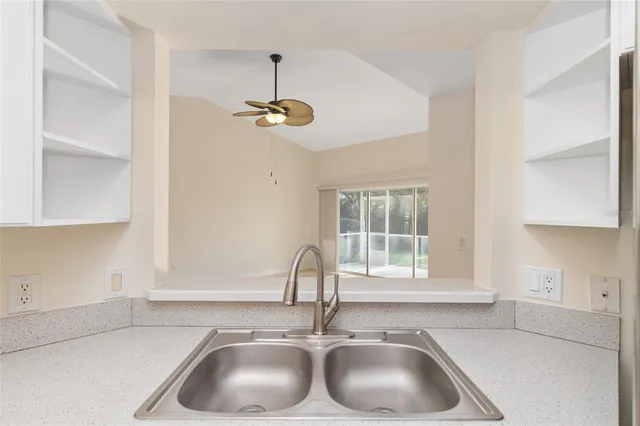 a bathroom with a sink and a window