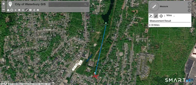 a red brick house with trees in front of it