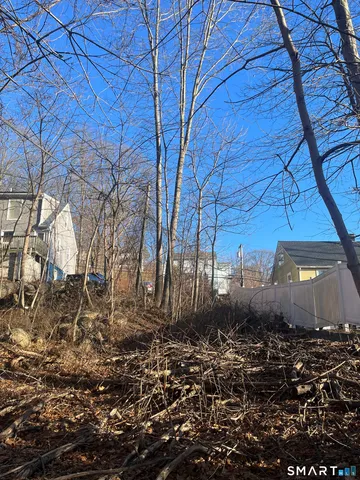 a view of a backyard of the house