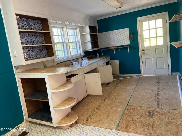 a room with cabinets and window