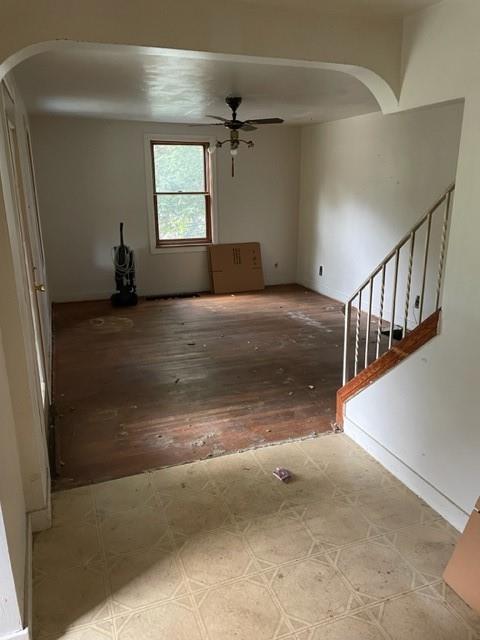 1050 Butler Road Springdale, PA 15144 - Photo 6 of 8 a view of empty room with wooden floor and fan