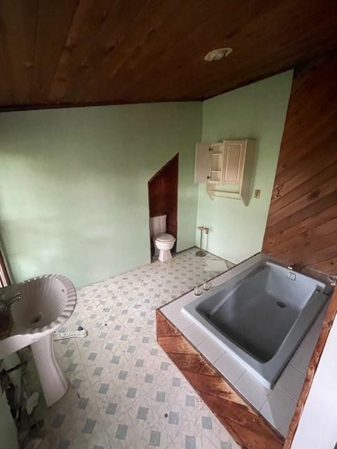 1050 Butler Road Springdale, PA 15144 - Photo 7 of 8 a bedroom with a bed and chair