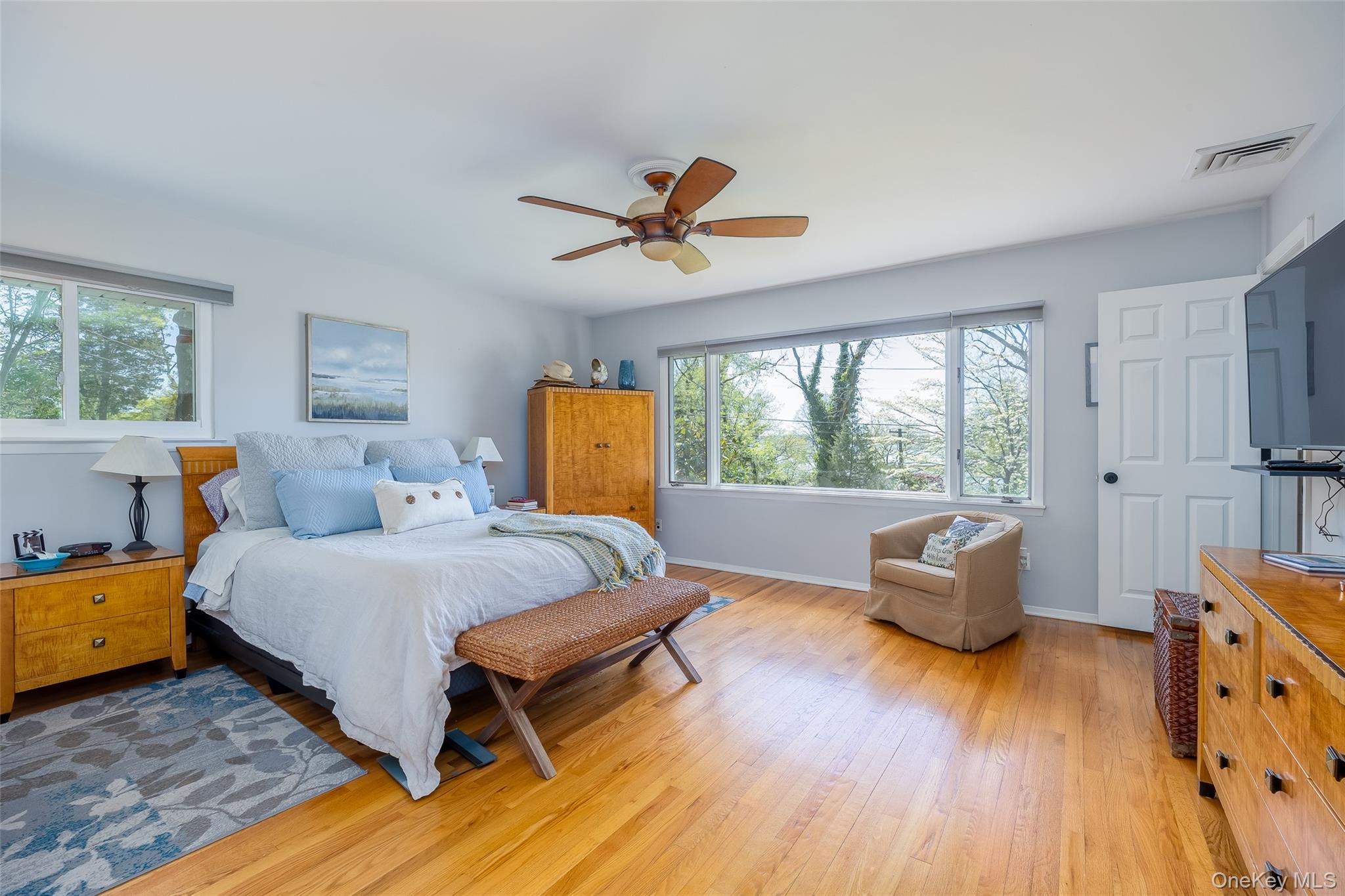 4 Knoll Top Road Stony Brook, NY 11790 - Photo 13 of 40 Primary bedroom with oak flooring and serene waterviews