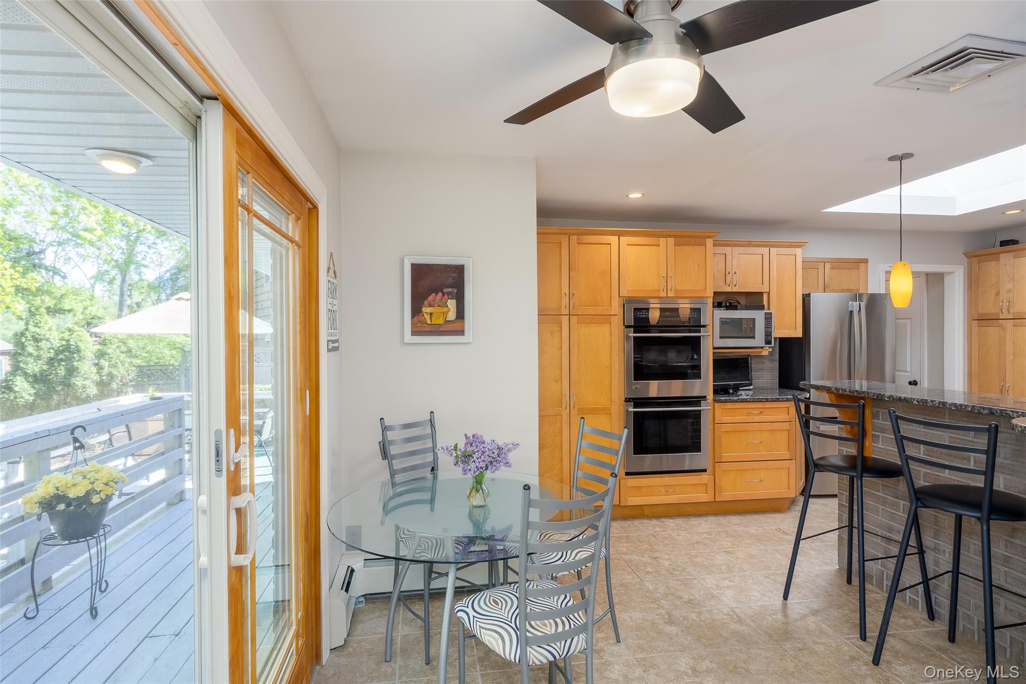4 Knoll Top Road Stony Brook, NY 11790 - Photo 10 of 40 Renovated Chef's kitchen with custom Maple cabinetry, granite countertops and SS appliances